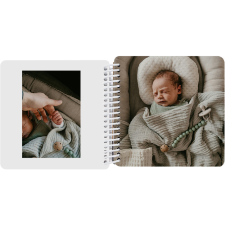 Personalized baby's first year board book featuring a newborn sleeping and first car ride photos