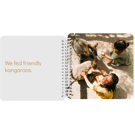 Two sisters feeding friendly kangaroos in a personalized Australia adventure board book