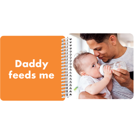 Baby being fed by dad in a personalized Daddy and Me board book with the message "Daddy feeds me"
