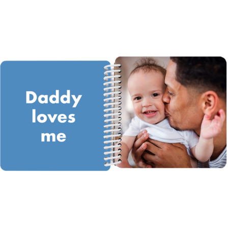 Dad kissing baby's cheek in a personalized Daddy and Me board book with the message "Daddy loves me"