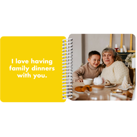Grandmother and grandson enjoying a family dinner in a personalized Grandma and Me board book with the message "I love having family dinners with you"