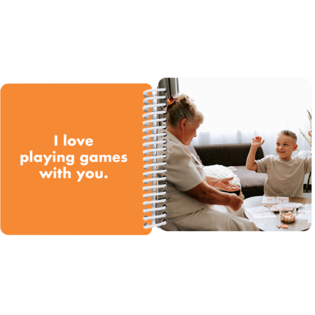 Grandmother and grandson playing bingo together in a personalized Grandma and Me board book with the message "I love playing games with you"