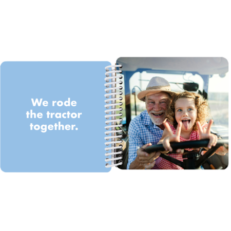 Grandfather and granddaughter riding a tractor together in a personalized Grandpa and Me board book with the message "We rode a tractor together"