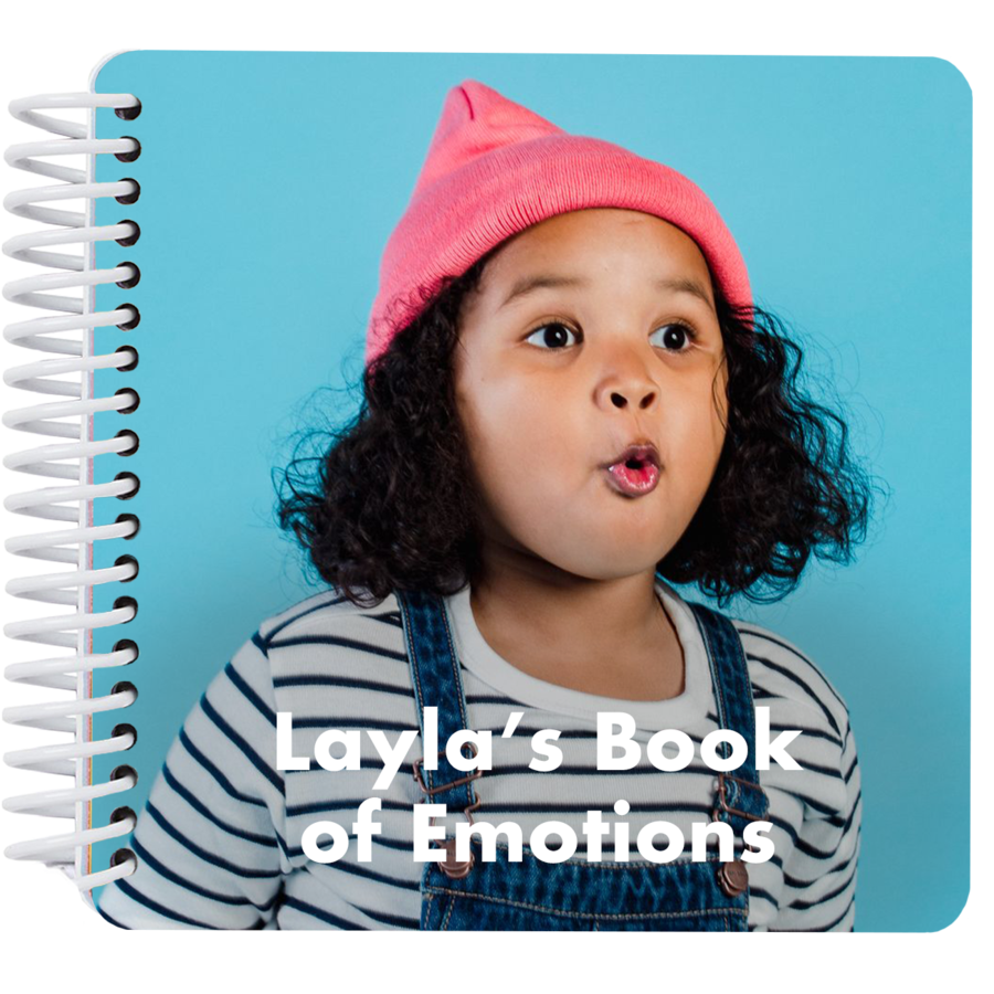 Personalized My Book of Emotions board book cover featuring a child making a surprised face with the title "Layla's Book of Emotions"