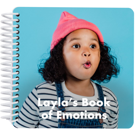 Personalized My Book of Emotions board book cover featuring a child making a surprised face with the title "Layla's Book of Emotions"