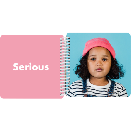 Child making a serious face in a personalized My Book of Emotions board book with the emotion "Serious"