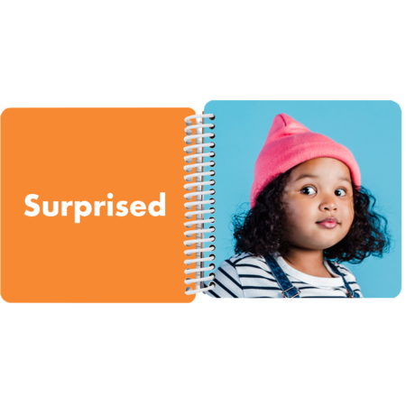 Child making a surprised face in a personalized My Book of Emotions board book with the emotion "Surprised"